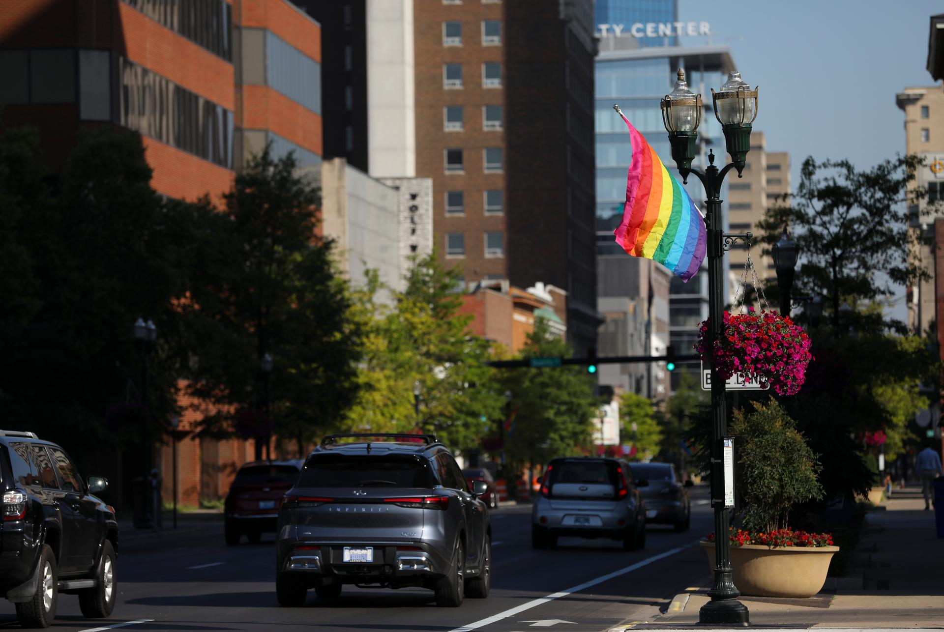 Pride flag flying on the lamp posts in downtown Lexington